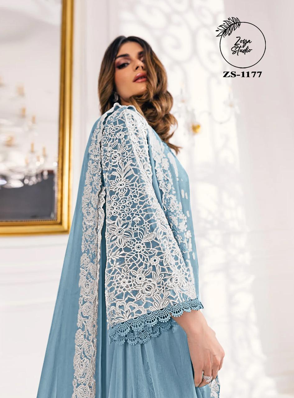 This beautiful Blue nd Purple outfit is rendered on a Organza base and features a straight shirt enlivened by intricate embroidery details on the front and sleeves