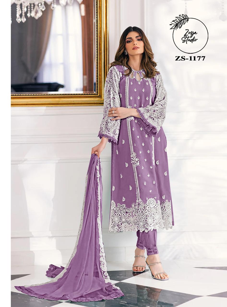This beautiful Blue nd Purple outfit is rendered on a Organza base and features a straight shirt enlivened by intricate embroidery details on the front and sleeves