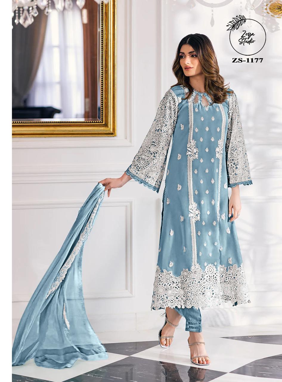 This beautiful Blue nd Purple outfit is rendered on a Organza base and features a straight shirt enlivened by intricate embroidery details on the front and sleeves