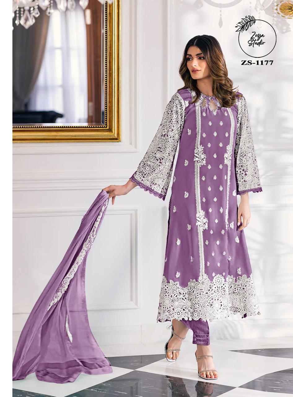 This beautiful Blue nd Purple outfit is rendered on a Organza base and features a straight shirt enlivened by intricate embroidery details on the front and sleeves
