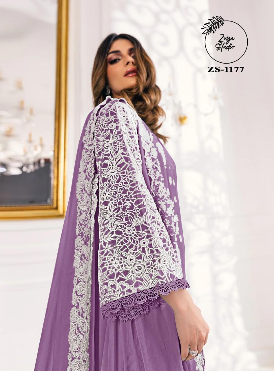 This beautiful Blue nd Purple outfit is rendered on a Organza base and features a straight shirt enlivened by intricate embroidery details on the front and sleeves