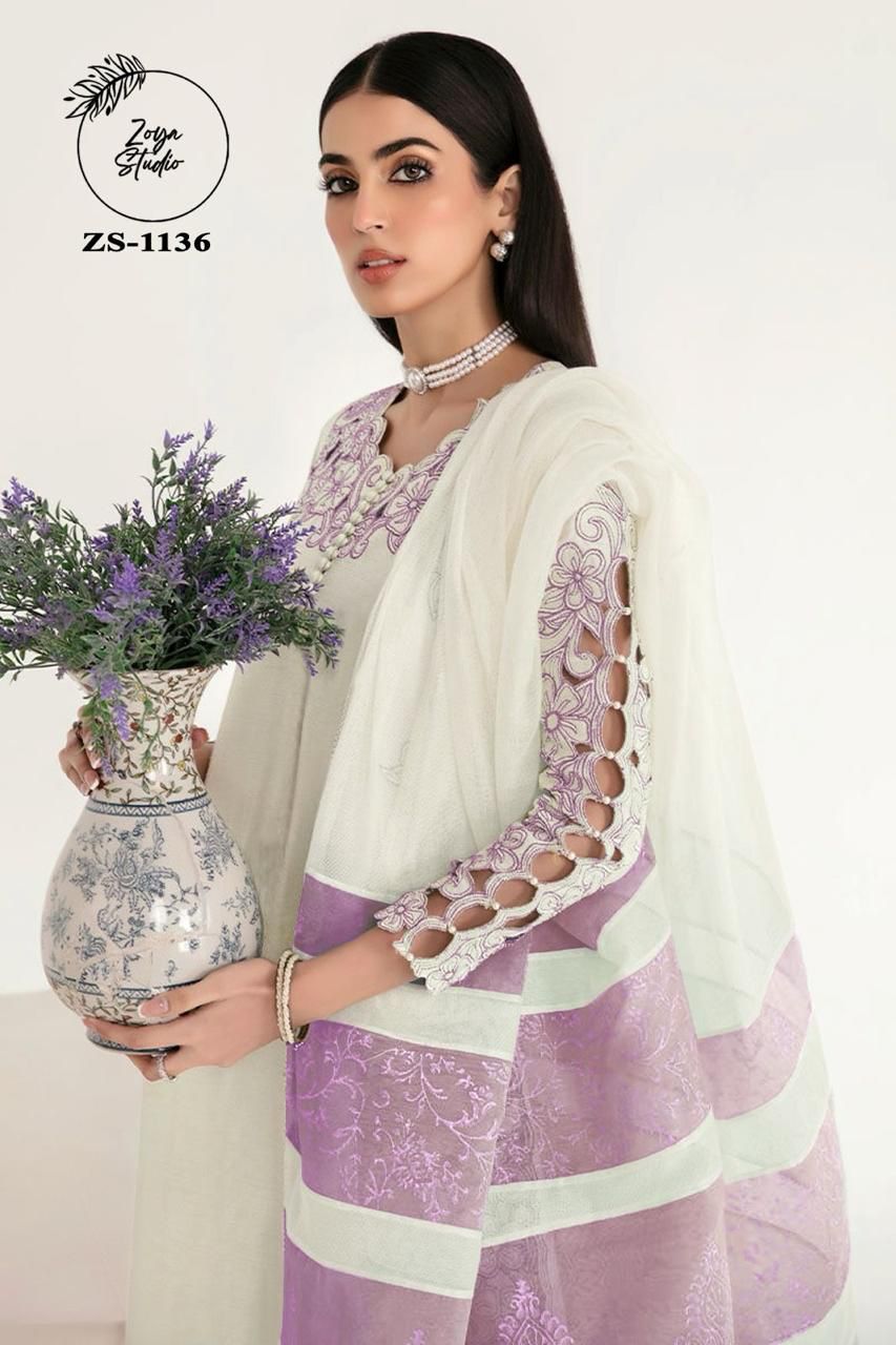 Georgotte straight shirt with heavy embroidered cutwork details beautifuly composed all over the shirt and sleeves with scalloped edging and sleek straight cut button down neckline