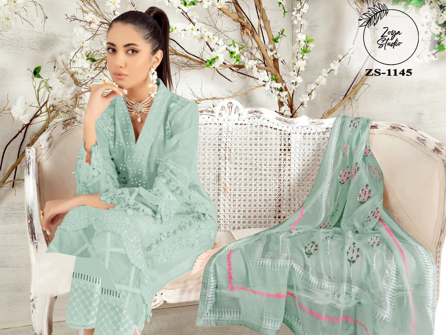 Cut from breathable embroidered Georgette, this heavenly pink Peach Nd Blue Color simple silhouette kurta features cross stitch colorful silk thread work along with panel & sleeves