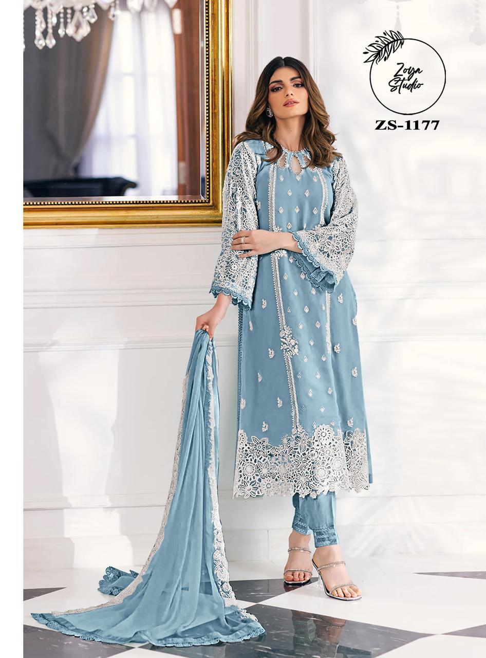 This beautiful Blue nd Purple outfit is rendered on a Organza base and features a straight shirt enlivened by intricate embroidery details on the front and sleeves