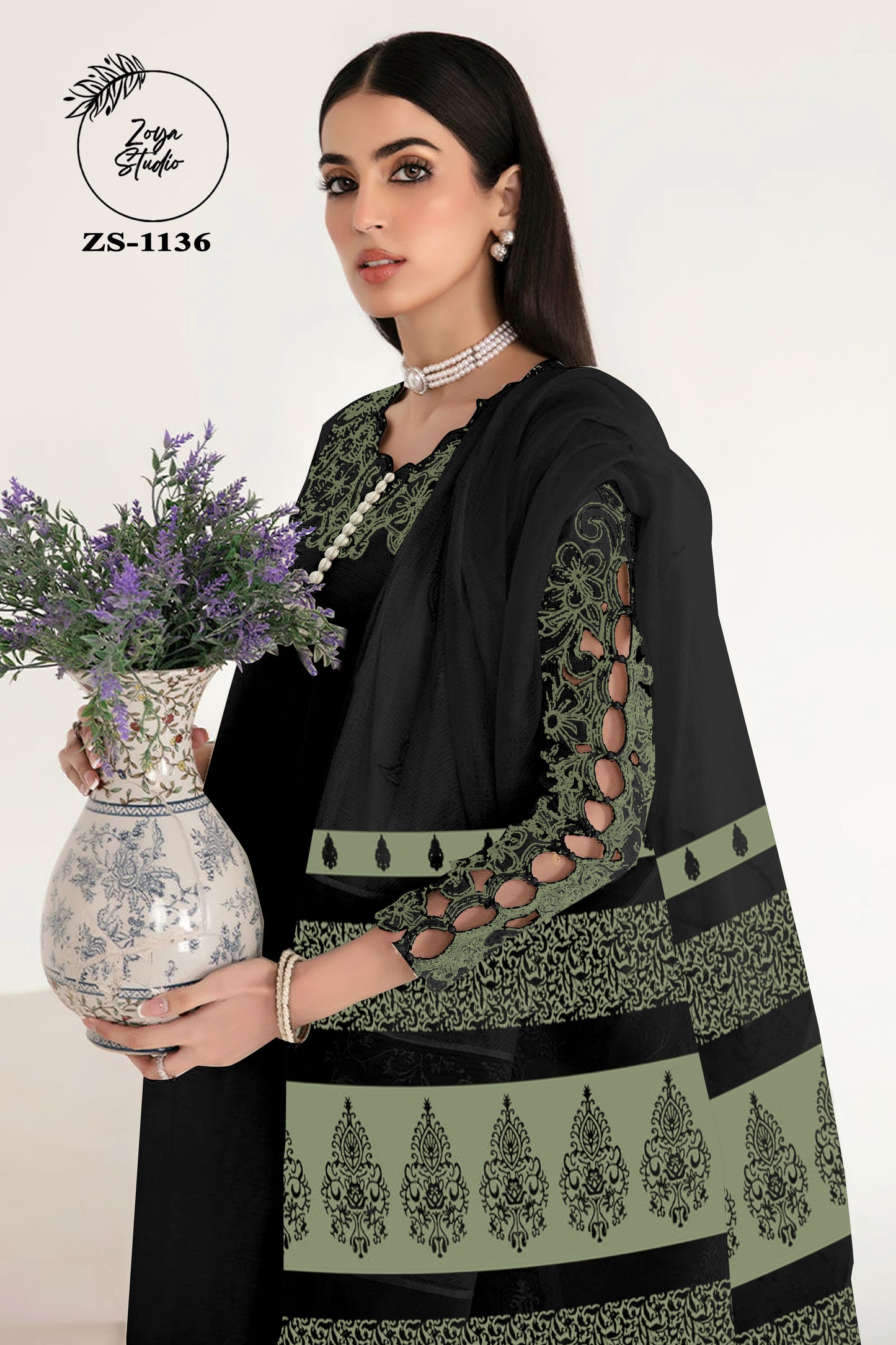 Georgotte straight shirt with heavy embroidered cutwork details beautifuly composed all over the shirt and sleeves with scalloped edging and sleek straight cut button down neckline