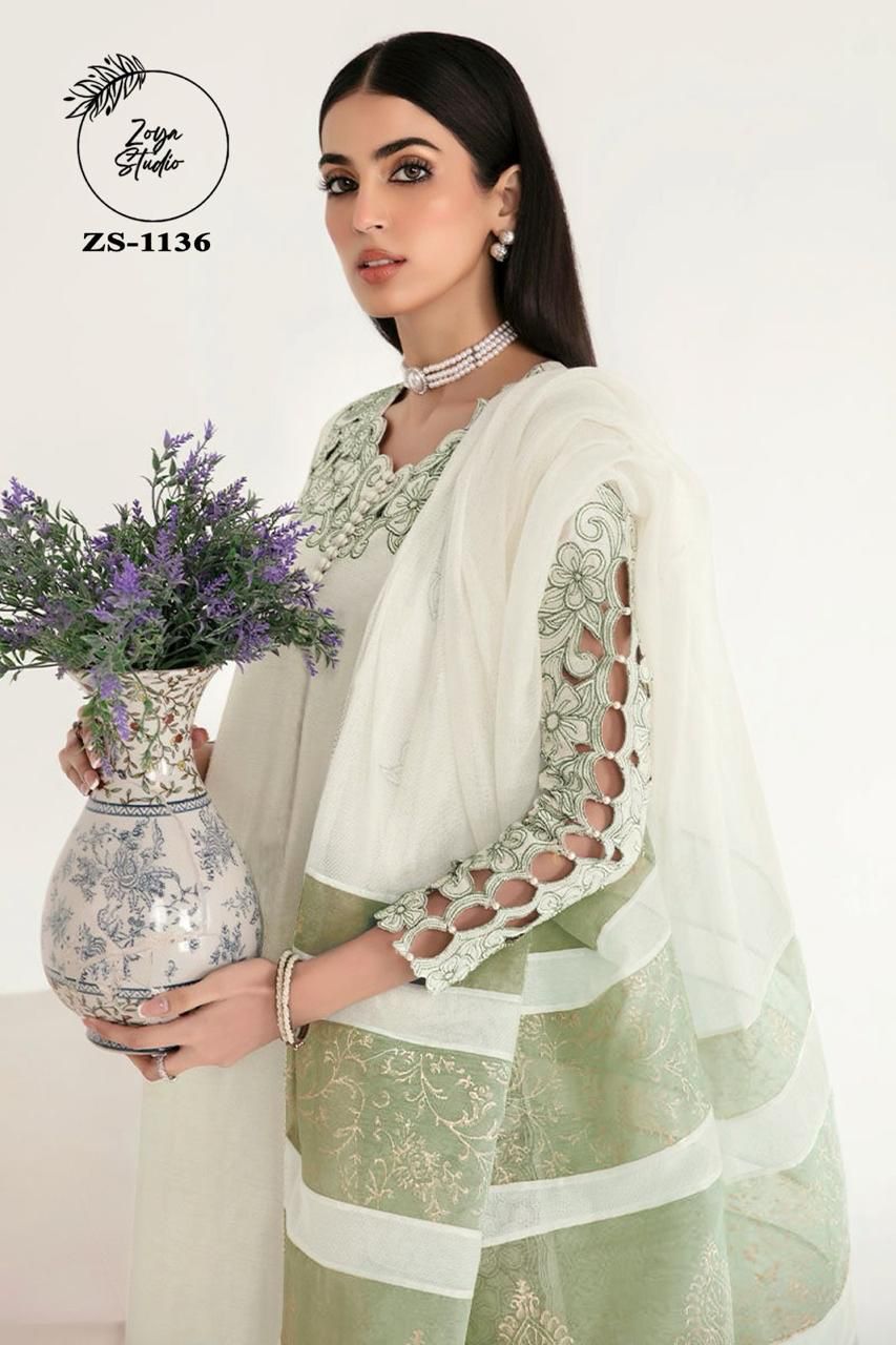 Georgotte straight shirt with heavy embroidered cutwork details beautifuly composed all over the shirt and sleeves with scalloped edging and sleek straight cut button down neckline