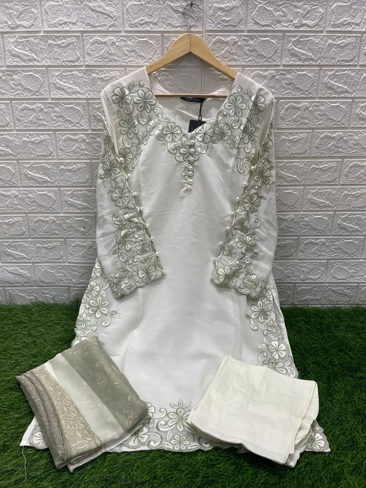 Georgotte straight shirt with heavy embroidered cutwork details beautifuly composed all over the shirt and sleeves with scalloped edging and sleek straight cut button down neckline