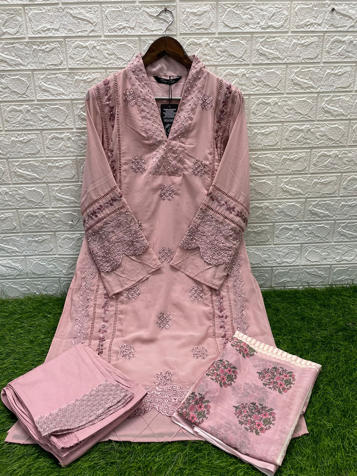 Cut from breathable embroidered Georgette, this heavenly pink Peach Nd Blue Color simple silhouette kurta features cross stitch colorful silk thread work along with panel & sleeves